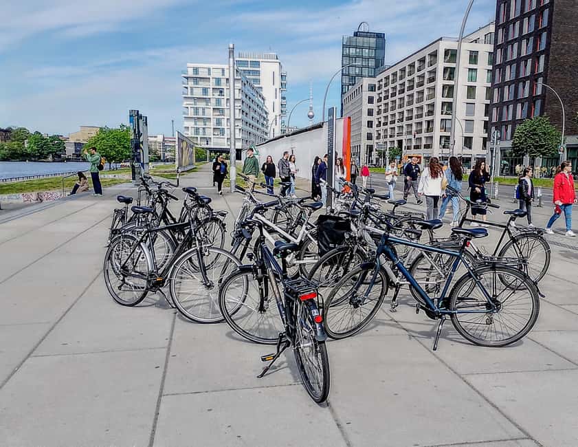 Berlin: East and West Wall Tour by Bike with a Guide - Unter den Linden to Brandenburg Gate: A Photo Stop That Actually Teaches