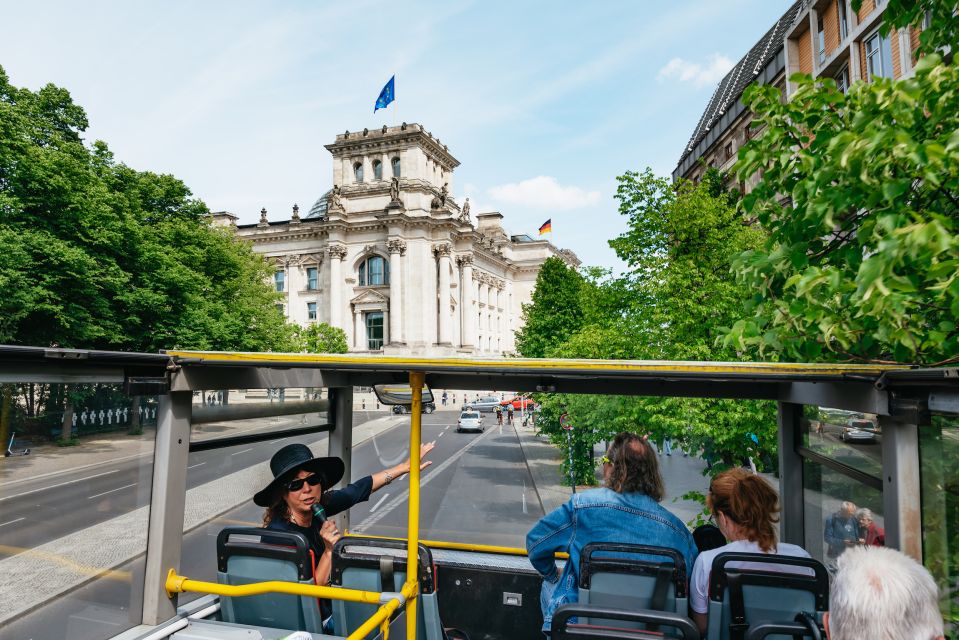 Berlin: Hop-on Hop-off Bus Tour with Live Commentary - Checkpoint Charlie, Gendarmenmarkt, and Alexanderplatz (plus the Neptune Fountain)