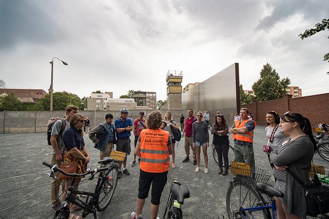 Berlin Wall and Cold War Bike Tour in Small Groups - Stop 1: Brandenburg Gate makes the Cold War feel real
